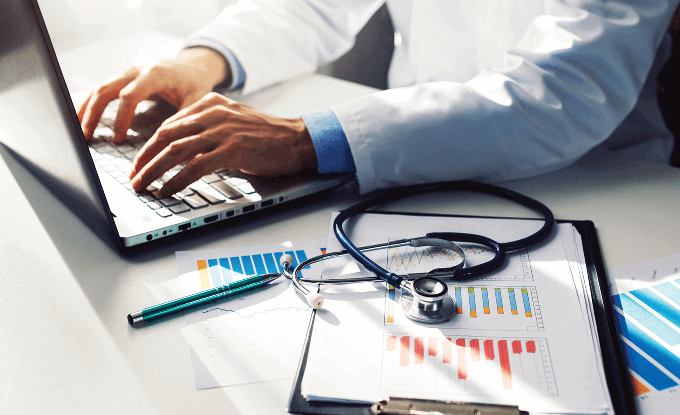 Dr on computer typing